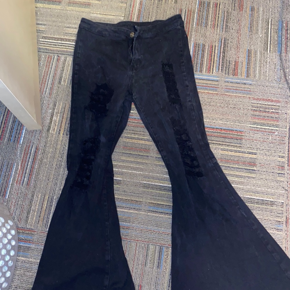 black ripped high rise flare jeans